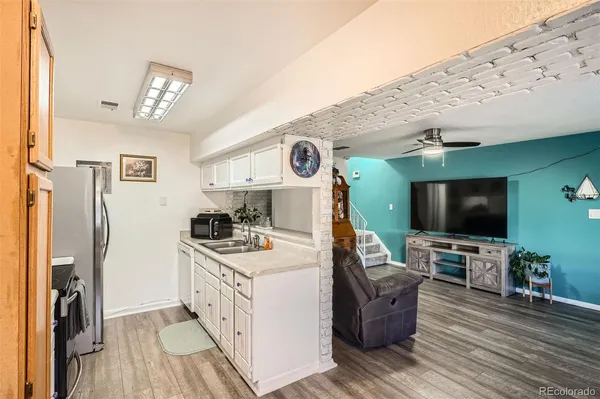 a view of living room with furniture and a flat screen tv