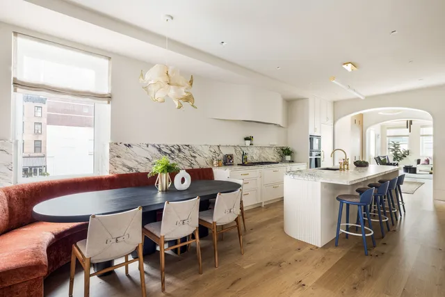 a spacious bedroom with a bed and a window