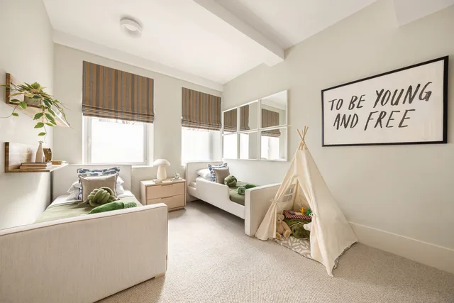 a bathroom with a double vanity sink toilet and shower
