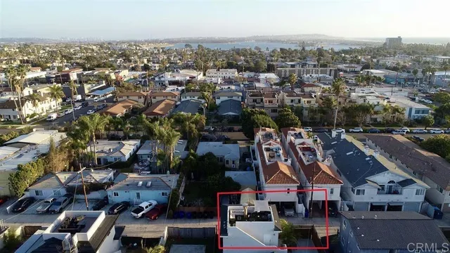 a view of chairs and table in backyard
