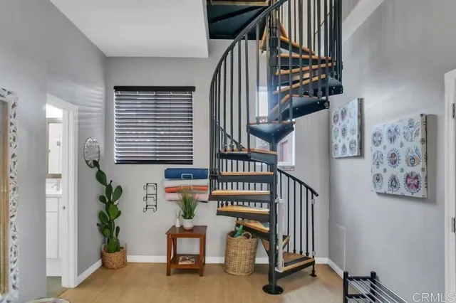 a bedroom with a bed and a mirror