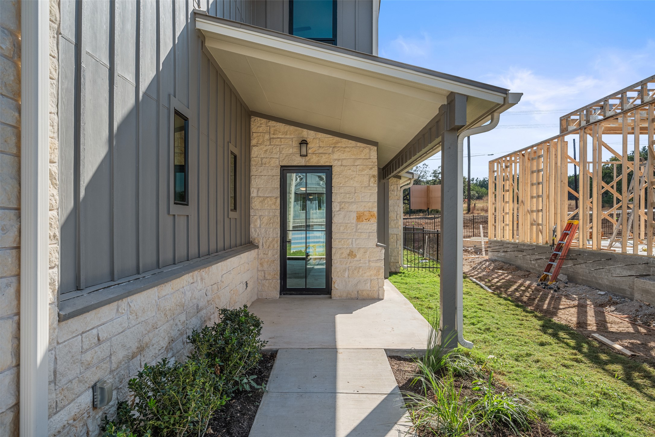 711 Paleface Ranch Road, Unit 3 Spicewood, TX 78669 - Photo 2 of 32 a porch with seating space