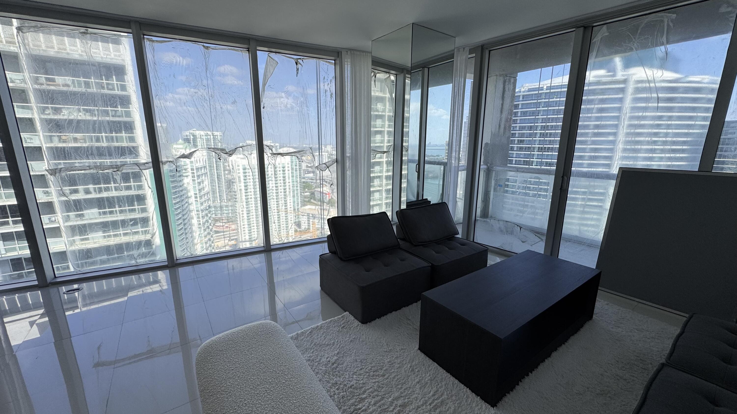 475 Brickell Avenue, Unit 4615 Miami, FL 33131 - Photo 13 of 13 a living room with furniture and a large window