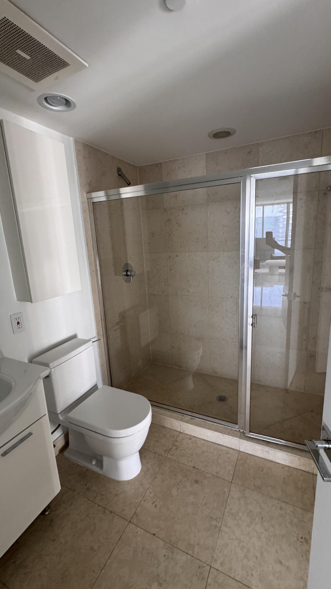 475 Brickell Avenue, Unit 4615 Miami, FL 33131 - Photo 6 of 13 a bathroom with a toilet and a shower