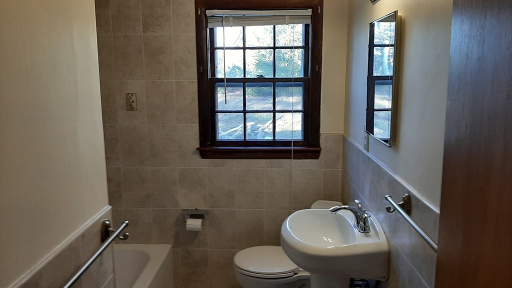 8 Paddock Drive Harwich, MA 02645 - Photo 11 of 12 a bathroom with a sink mirror and toilet