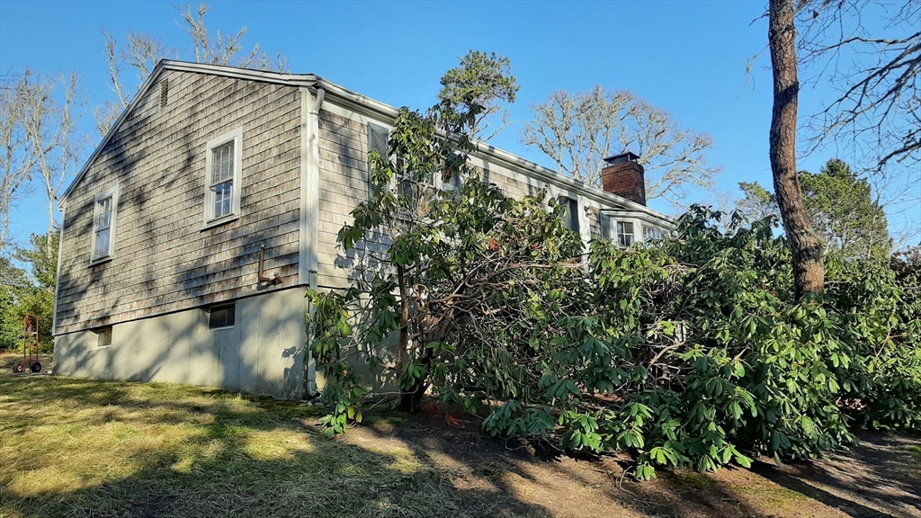 8 Paddock Drive Harwich, MA 02645 - Photo 3 of 12 a view of a back yard of the house