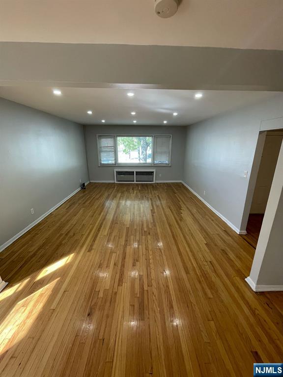 388-390 Leslie Street, Unit 1 Newark, NJ 07112 - Photo 18 of 21 wooden floor in an empty room with wooden floor