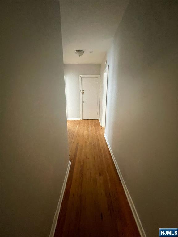 388-390 Leslie Street, Unit 1 Newark, NJ 07112 - Photo 21 of 21 a view of a hallway with wooden floor