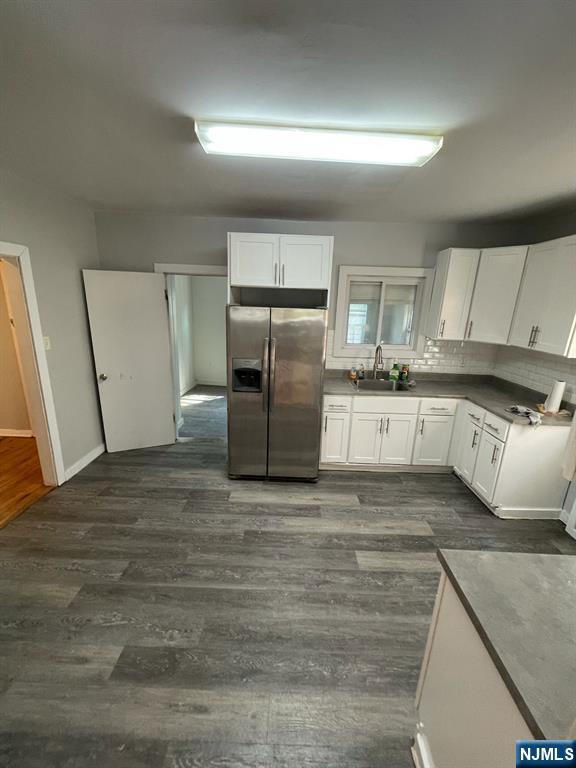 388-390 Leslie Street, Unit 1 Newark, NJ 07112 - Photo 4 of 21 a large kitchen with stainless steel appliances granite countertop a refrigerator a stove and a sink