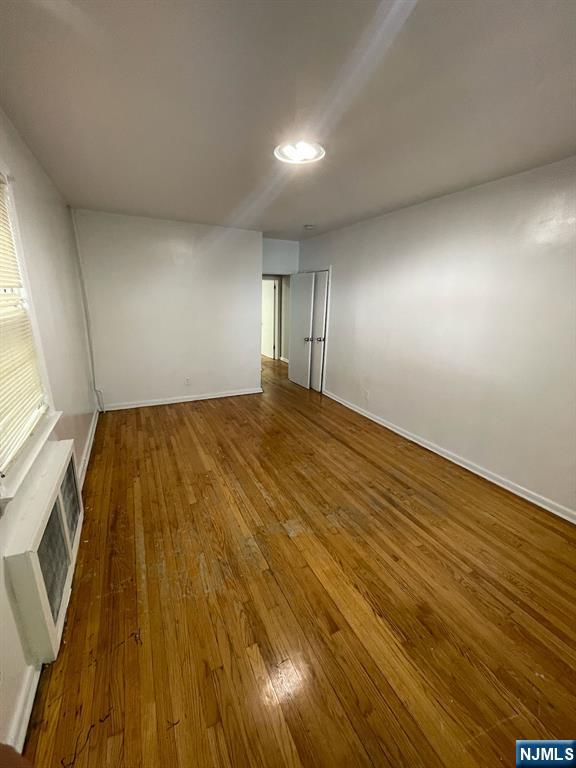 388-390 Leslie Street, Unit 1 Newark, NJ 07112 - Photo 6 of 21 a view of an empty room and window