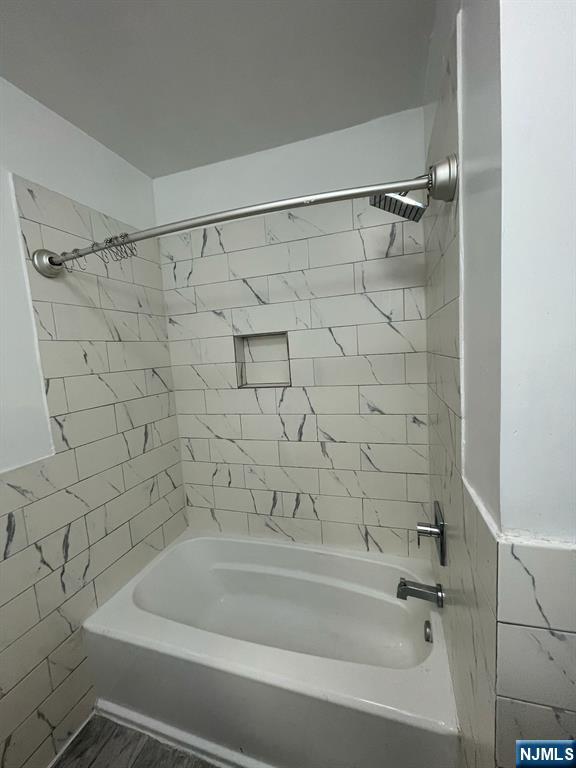 388-390 Leslie Street, Unit 1 Newark, NJ 07112 - Photo 7 of 21 a bathroom with a bathtub and a shower