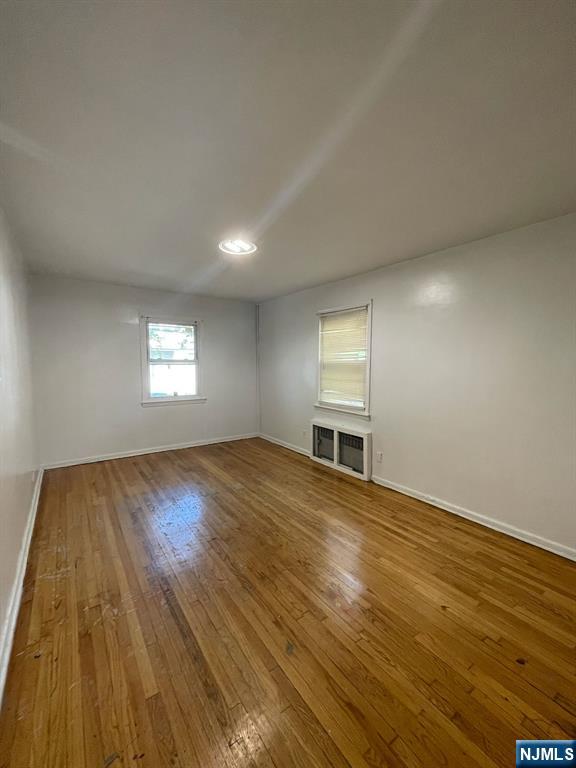 388-390 Leslie Street, Unit 1 Newark, NJ 07112 - Photo 10 of 21 a view of empty room with wooden floor and fan