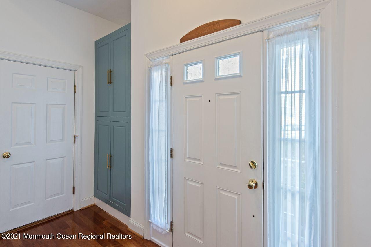 501 Abby Road Middletown, NJ 07748 - Photo 3 of 36 a view of a bathroom with a glass door and a window