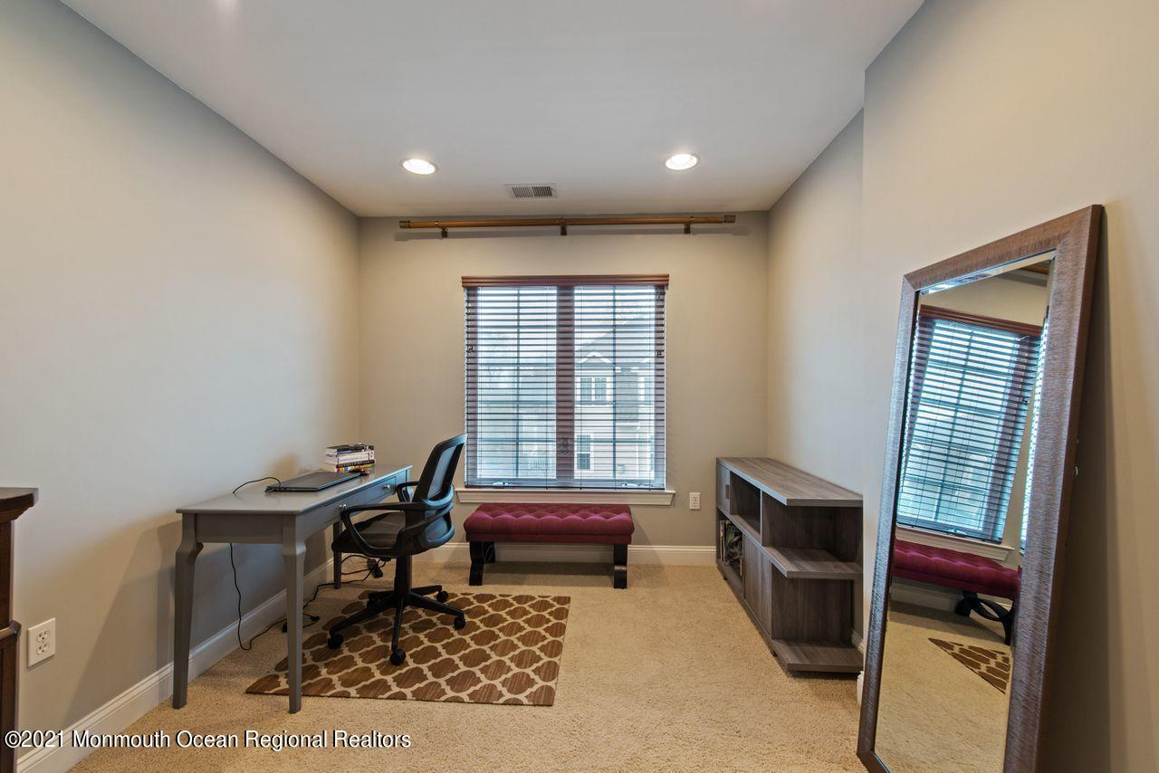 501 Abby Road Middletown, NJ 07748 - Photo 22 of 36 a living room with furniture a window and a table