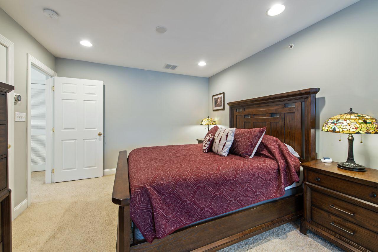 501 Abby Road Middletown, NJ 07748 - Photo 24 of 36 a bedroom with a bed and a dresser