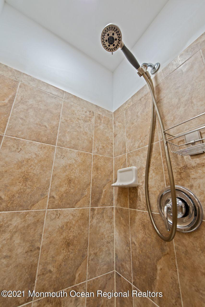 501 Abby Road Middletown, NJ 07748 - Photo 26 of 36 a bathroom with a shower