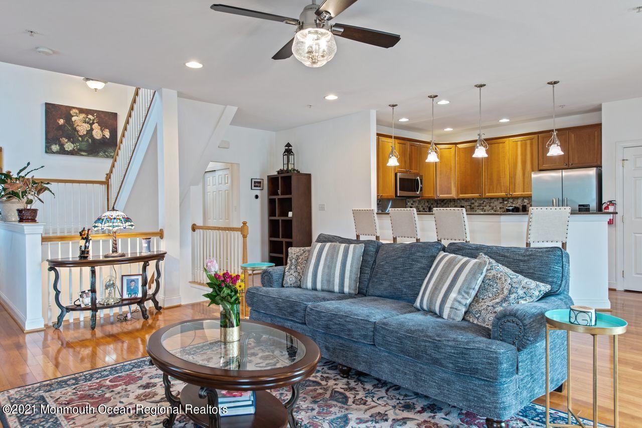 501 Abby Road Middletown, NJ 07748 - Photo 6 of 36 a living room with furniture and a chandelier