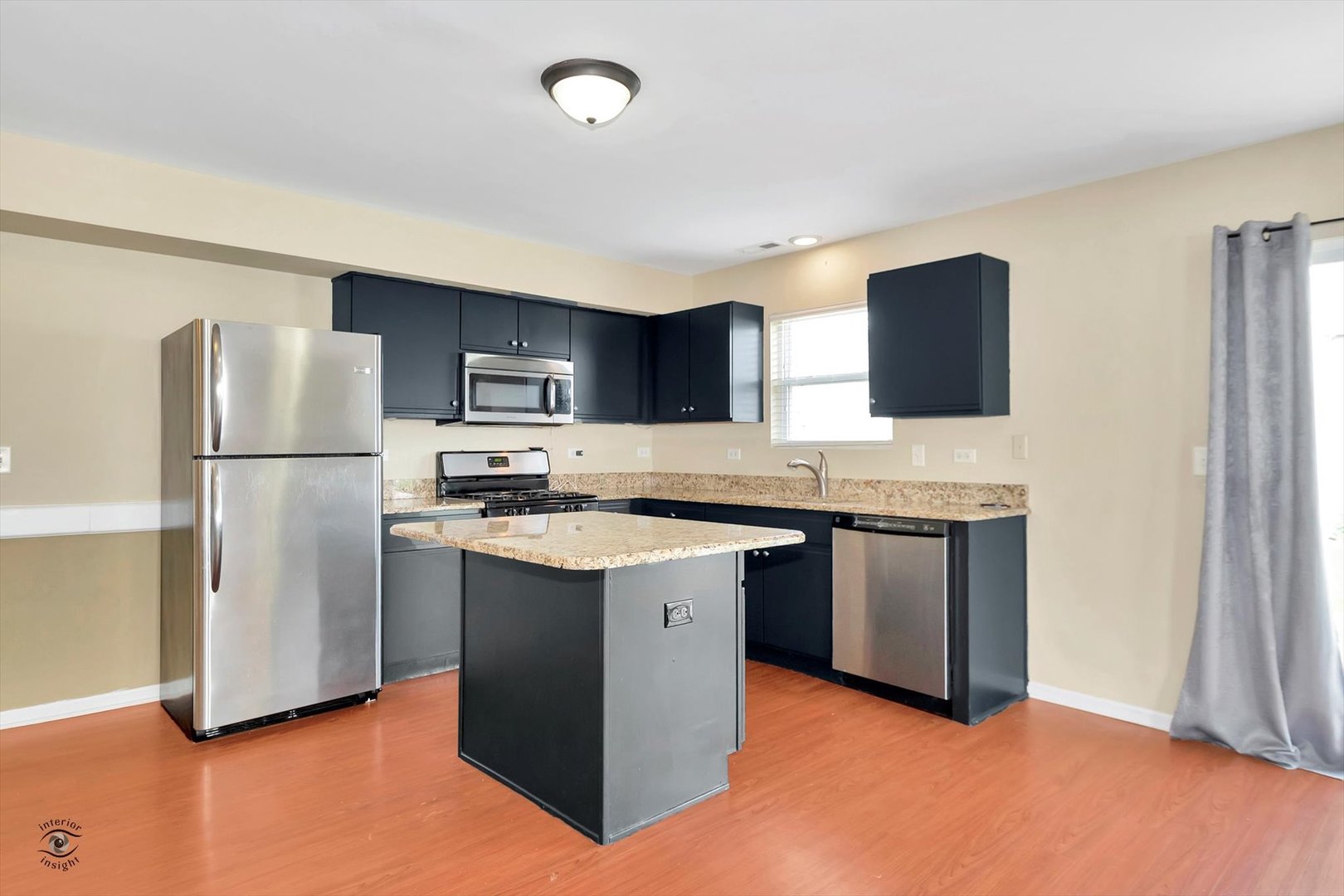 25208 Faraday Road Manhattan, IL 60442 - Photo 11 of 24 a kitchen with stainless steel appliances granite countertop a refrigerator stove a sink and a microwave