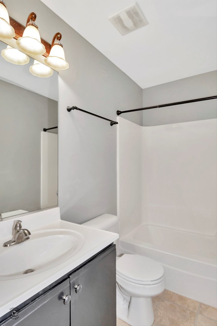 25208 Faraday Road Manhattan, IL 60442 - Photo 23 of 24 a bathroom with a sink toilet and shower