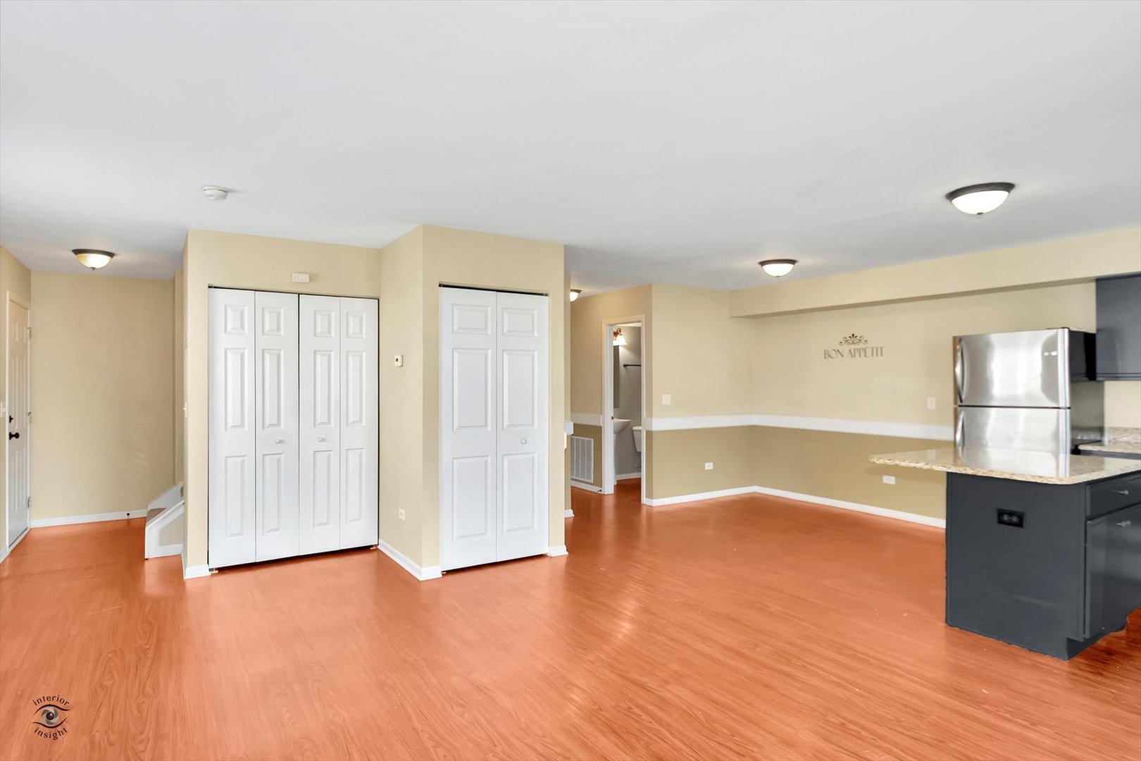 25208 Faraday Road Manhattan, IL 60442 - Photo 9 of 24 a view of an empty room with wooden floor and a window