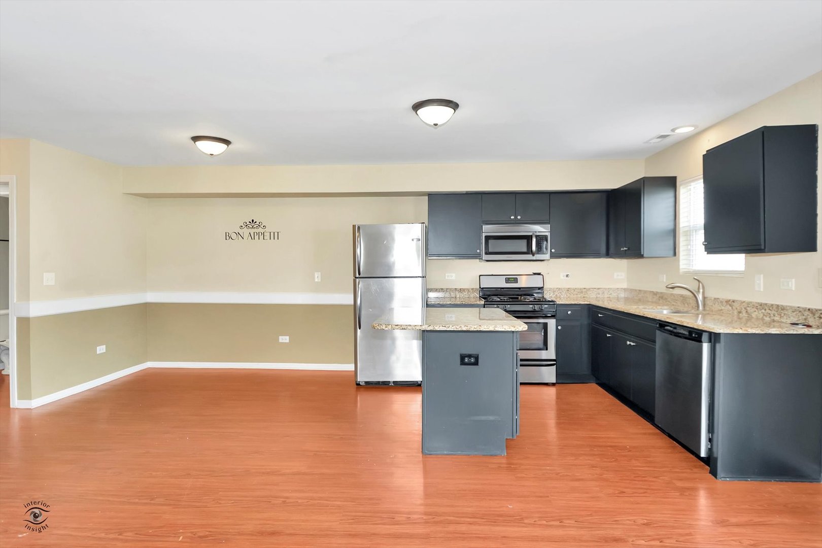 25208 Faraday Road Manhattan, IL 60442 - Photo 10 of 24 a large kitchen with stainless steel appliances granite countertop a sink a stove top oven a counter space and cabinets