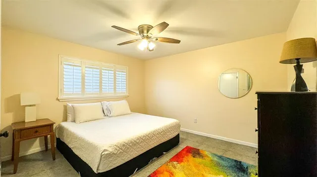 a bedroom with a bed and dresser