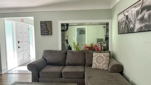 a living room with furniture and a window
