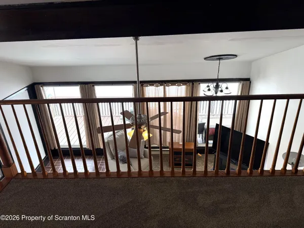 a view of staircase with lots of furniture