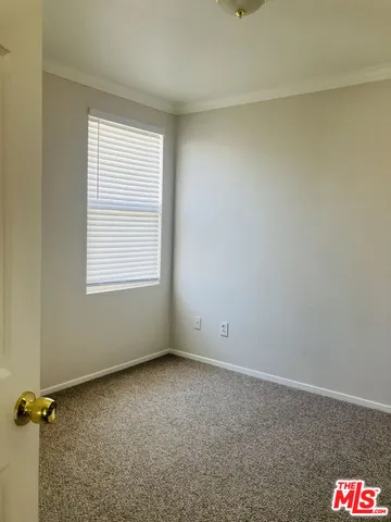 an empty room with a empty space and a window