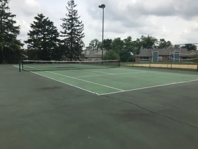a view of a lake with houses in the back