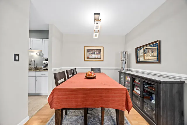 a dining room with a table and chairs