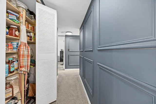 a view of hallway with cabinets