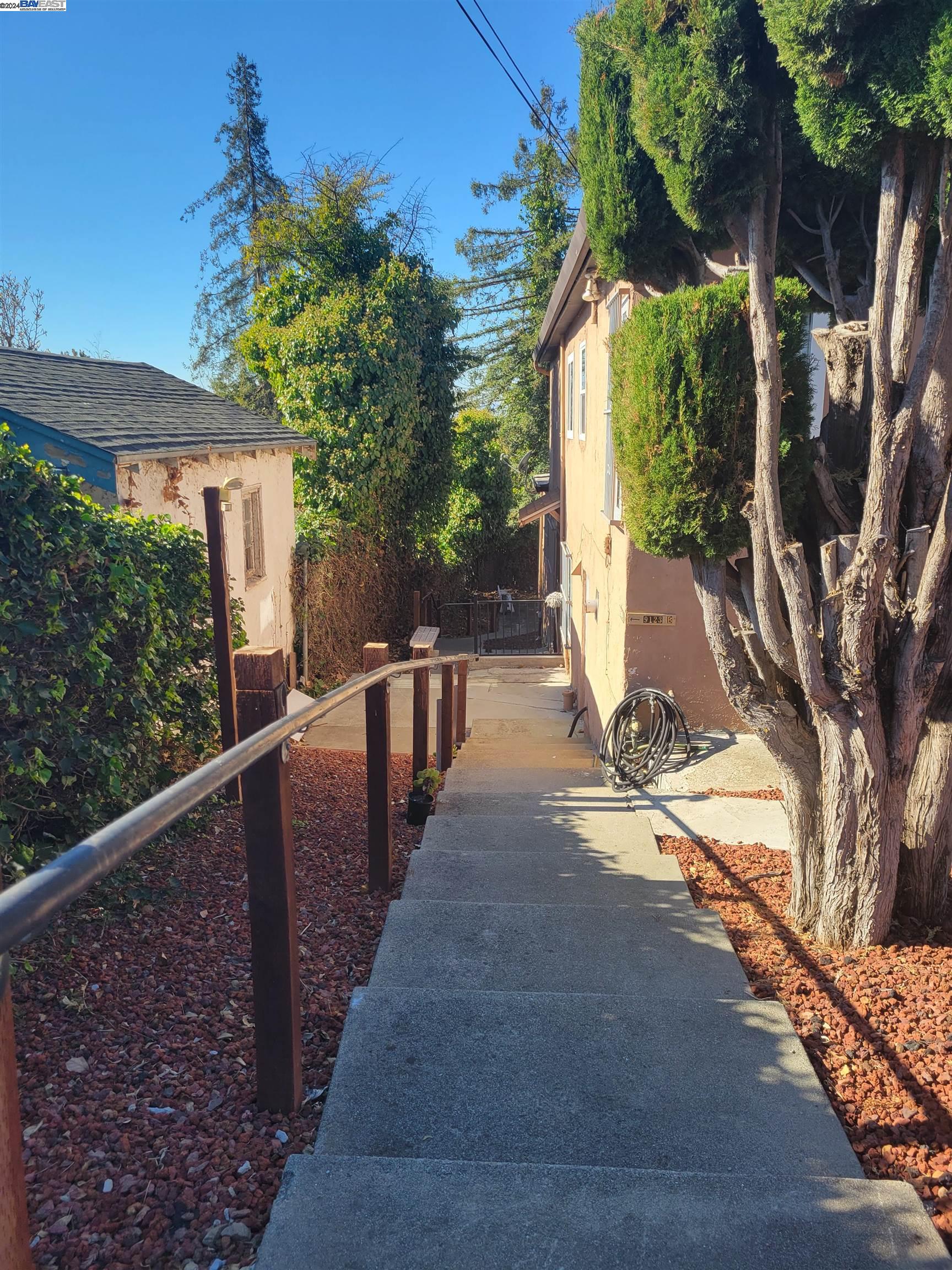 Toler Heights Oakland, CA 94605 - Photo 2 of 18 a view of a house with backyard and trees