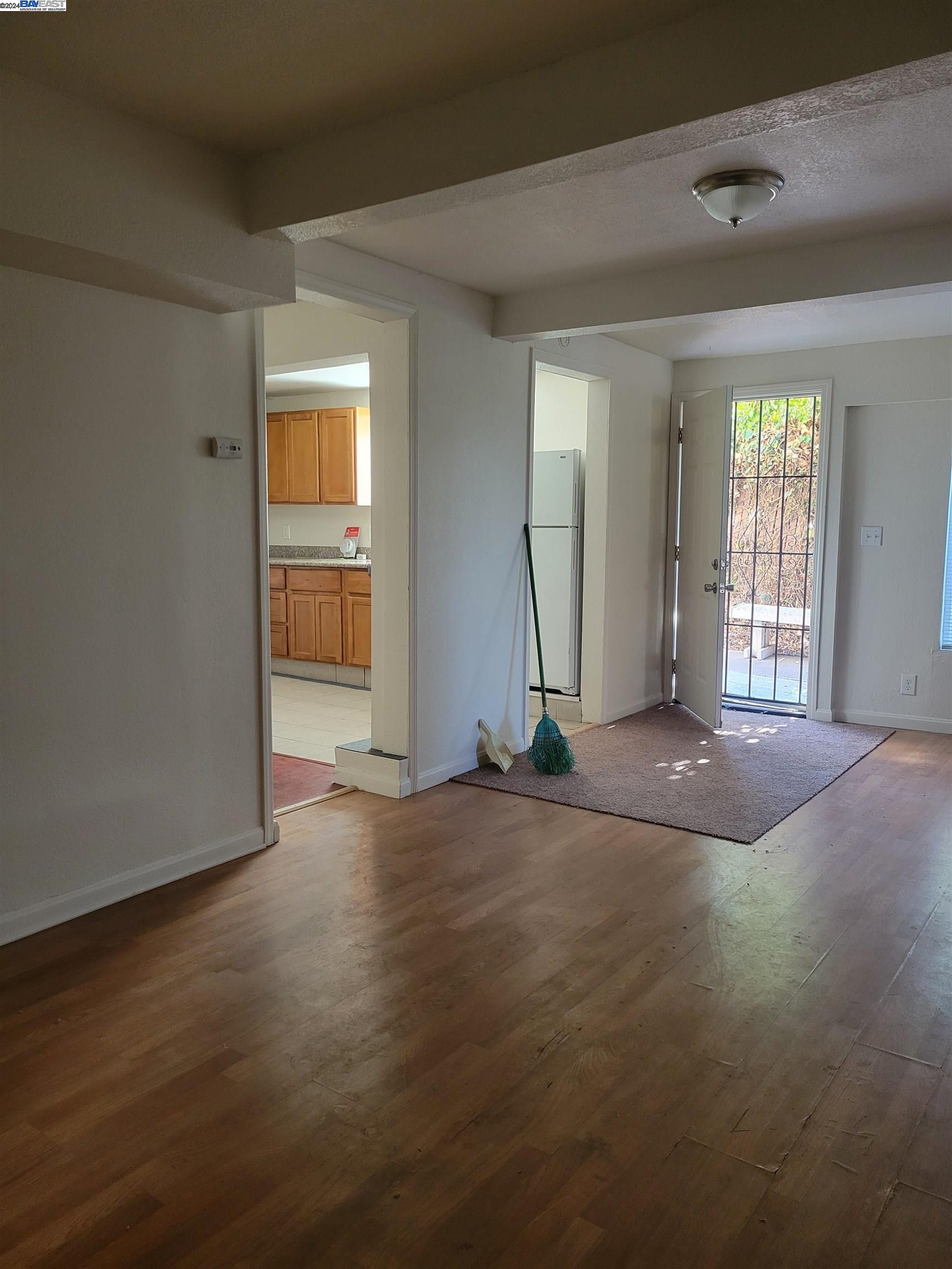 Toler Heights Oakland, CA 94605 - Photo 4 of 18 an empty room with wooden floor and windows