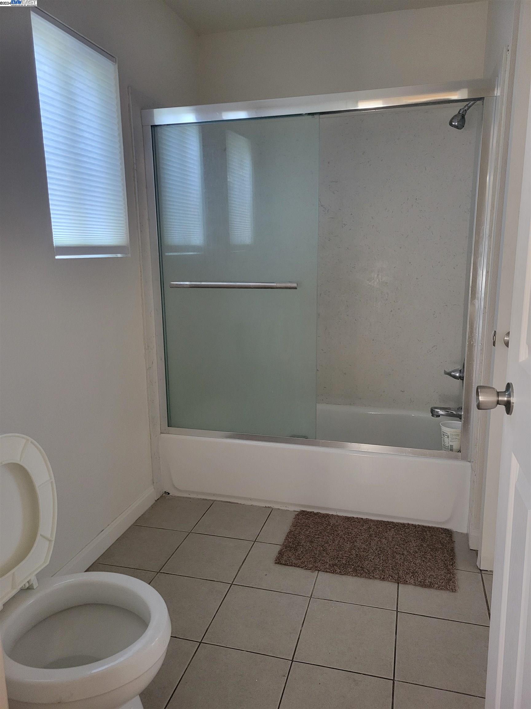 Toler Heights Oakland, CA 94605 - Photo 10 of 18 a bathroom with a toilet and a shower