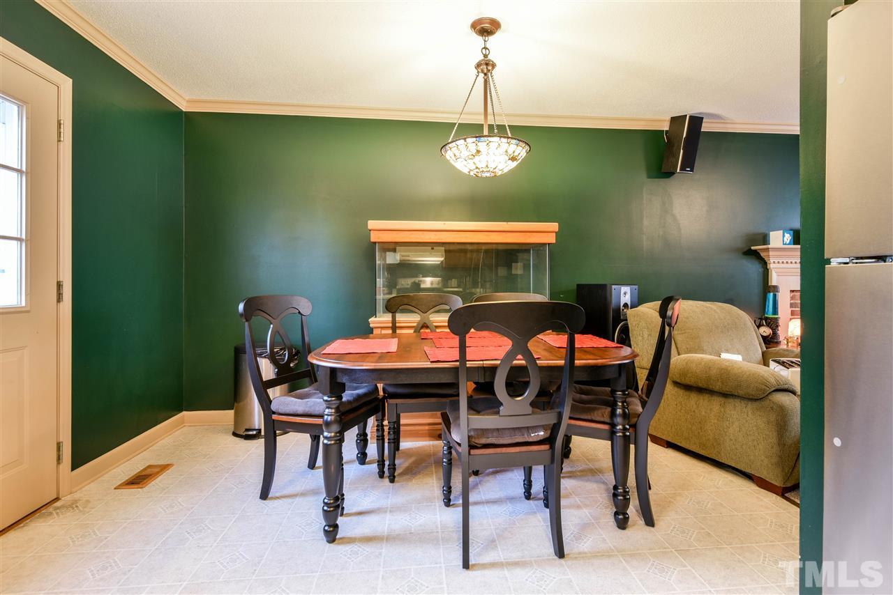 1017 Fairlong Road Wake Forest, NC 27587 - Photo 5 of 17 Keeps an open flow between kitchen and living area. Opens up to large deck on a large back yard!