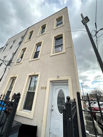 a kitchen with granite countertop a sink and a stove top oven