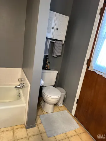 a bathroom with a toilet sink and bathtub