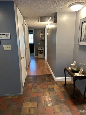 a room with table and a mirror