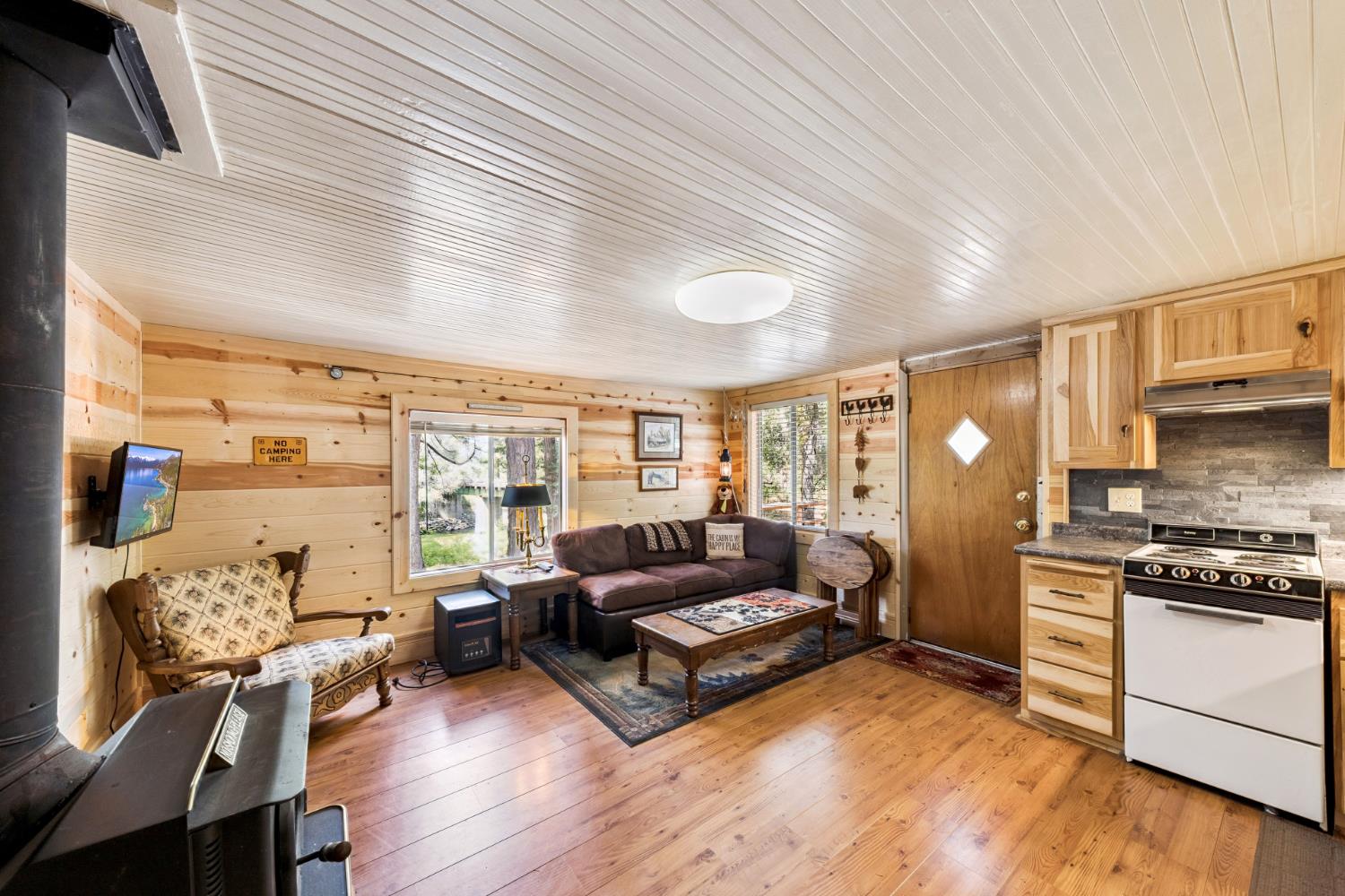 3045 Alder Creek Road, Unit 16 Pollock Pines, CA 95726 - Photo 12 of 20 a living room with furniture and a large window