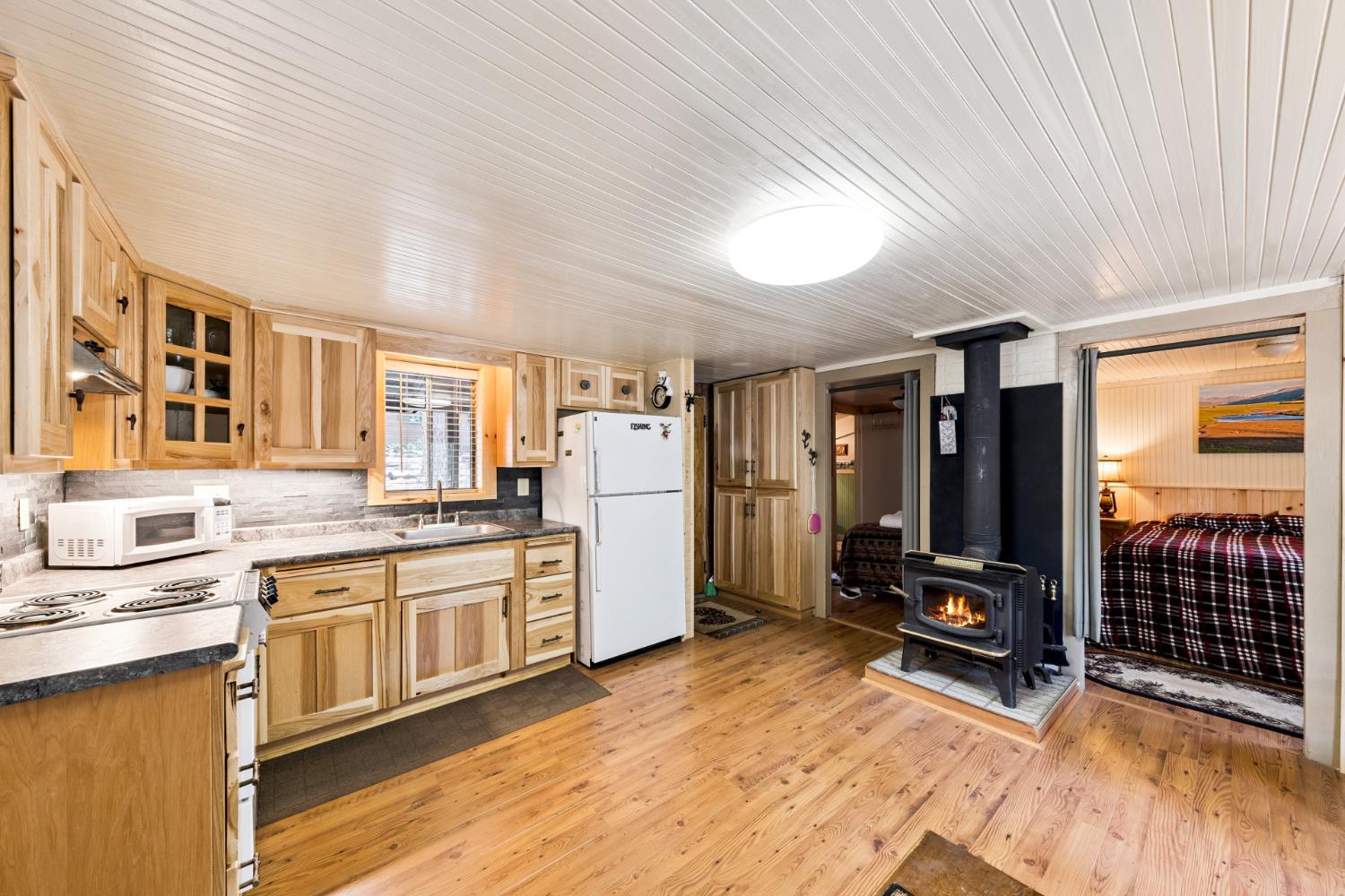 3045 Alder Creek Road, Unit 16 Pollock Pines, CA 95726 - Photo 15 of 20 a kitchen with stainless steel appliances granite countertop a stove a sink dishwasher and a refrigerator