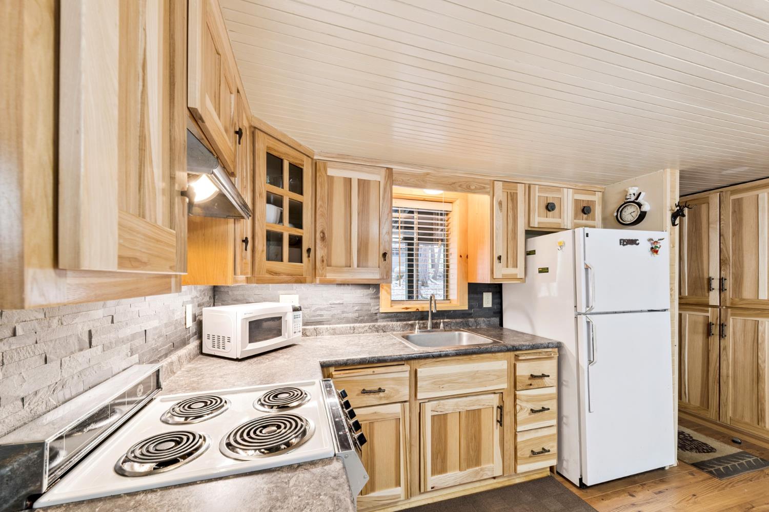 3045 Alder Creek Road, Unit 16 Pollock Pines, CA 95726 - Photo 16 of 20 a kitchen with a refrigerator a stove and a sink