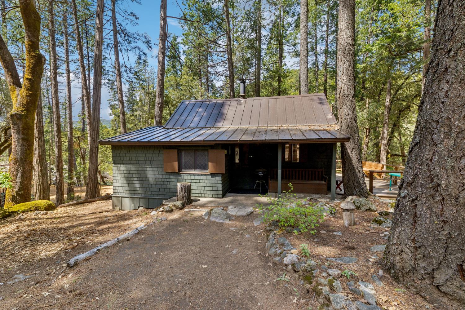 3045 Alder Creek Road, Unit 16 Pollock Pines, CA 95726 - Photo 7 of 20 a view of a house with large trees and outdoor space