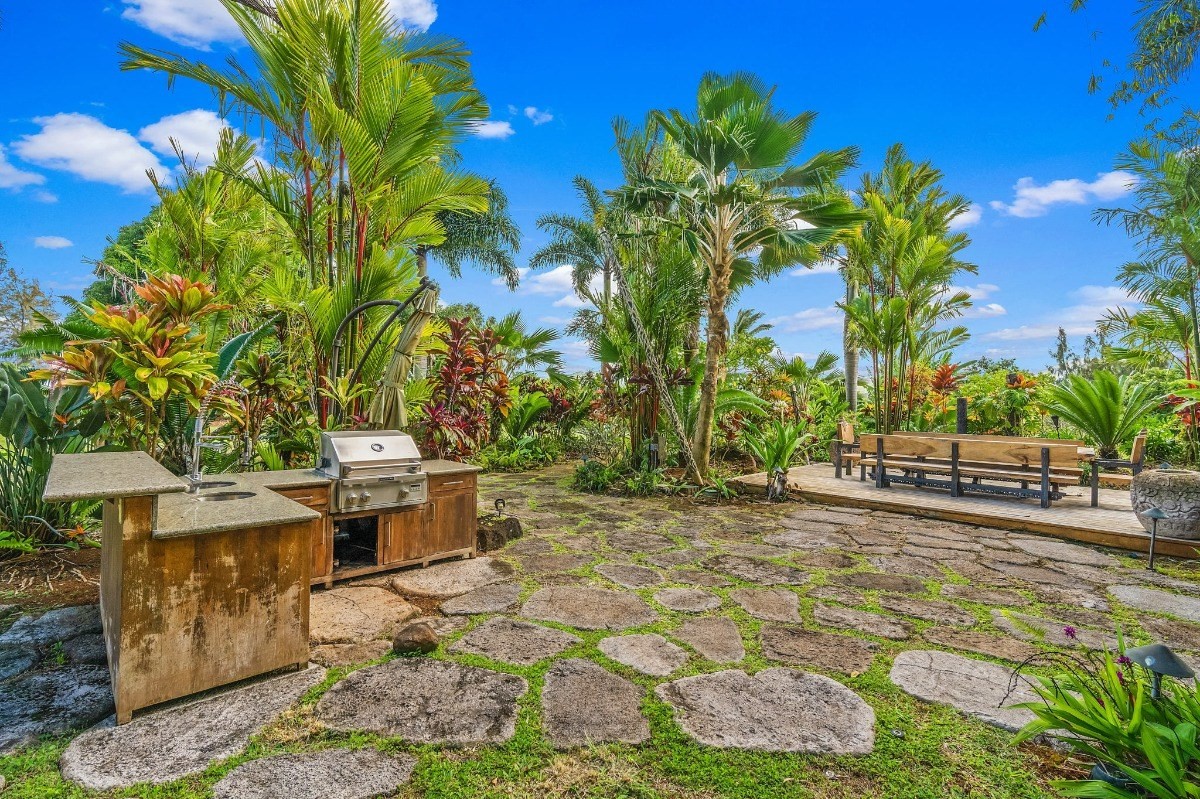 St, Unit 5 Kilauea, HI 96754 - Photo 15 of 26 a view of a backyard with plants