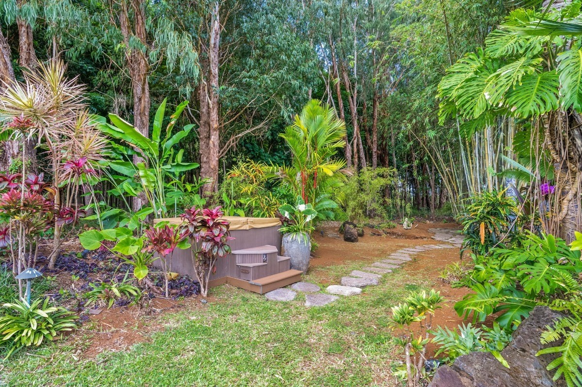 St, Unit 5 Kilauea, HI 96754 - Photo 16 of 26 a backyard of a house with lots of green space