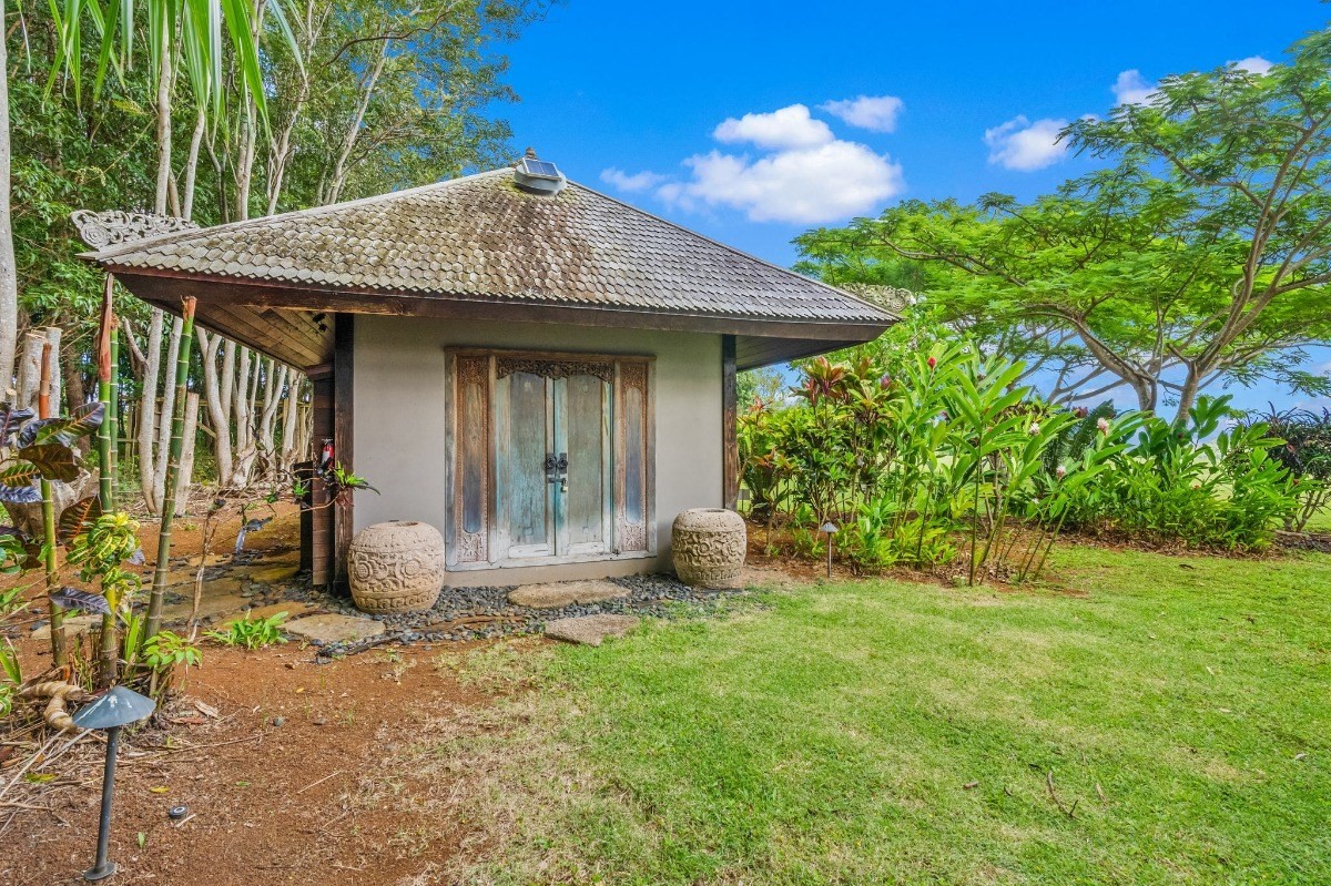 St, Unit 5 Kilauea, HI 96754 - Photo 17 of 26 a view of a house with yard and sitting area
