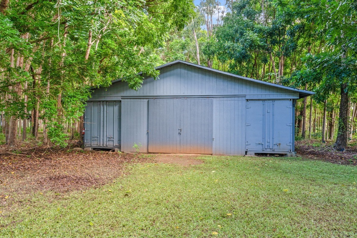 St, Unit 5 Kilauea, HI 96754 - Photo 21 of 26 a wooden house with a yard