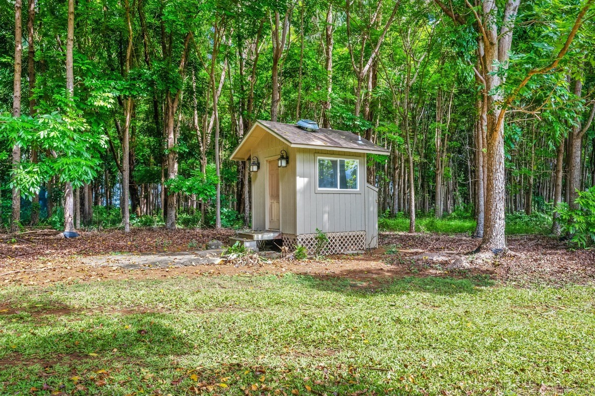 St, Unit 5 Kilauea, HI 96754 - Photo 22 of 26 a view of a house with backyard and trees