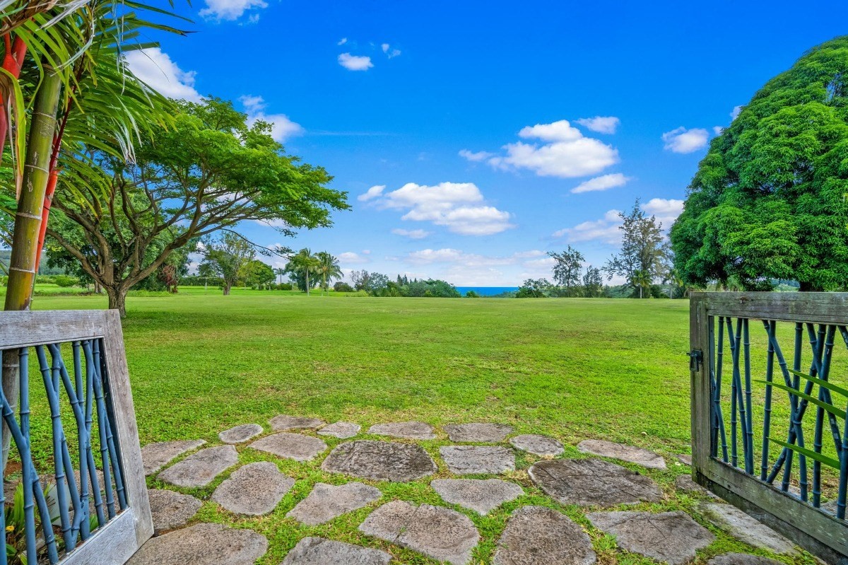 St, Unit 5 Kilauea, HI 96754 - Photo 9 of 26 a view of a garden with an outdoor space