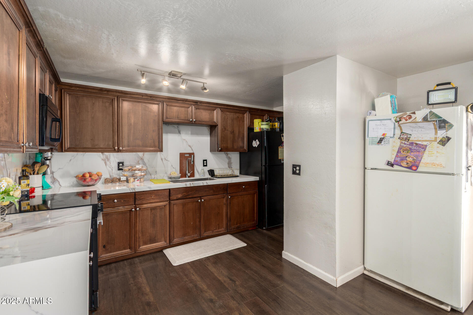 6224 West Berkeley Road Phoenix, AZ 85035 - Photo 11 of 27 a kitchen with a sink cabinets and window